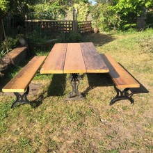Table and benches - iron bases with reclaimed timber tops.