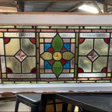Leaded glass panel in wooden frame.