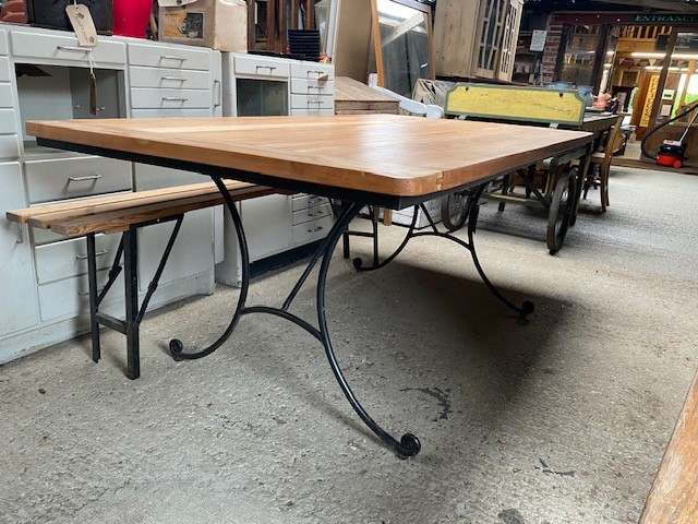 Table - large hardwood top on industrial base.