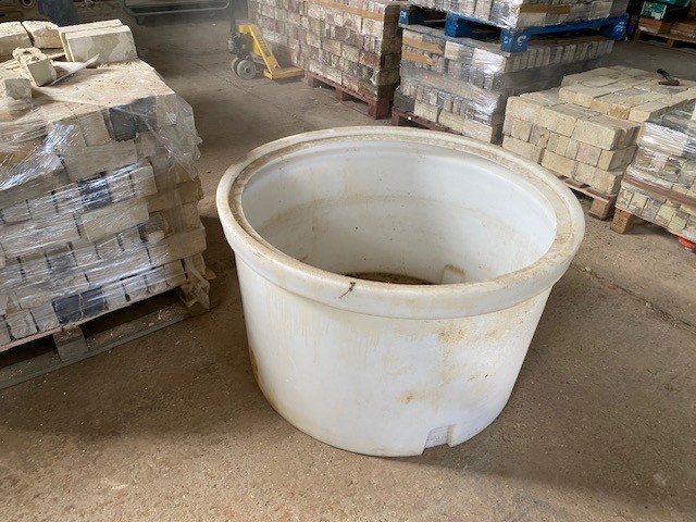 Large plastic water butt or container.