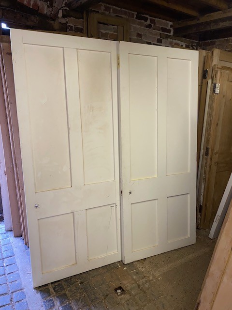 Pair large 4-panel doors , still in paint.