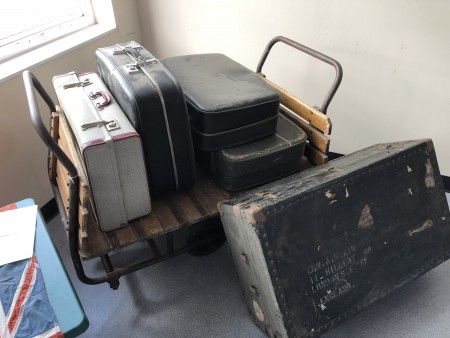 Suitcase trolley or porters trolley - with suitcases as required.